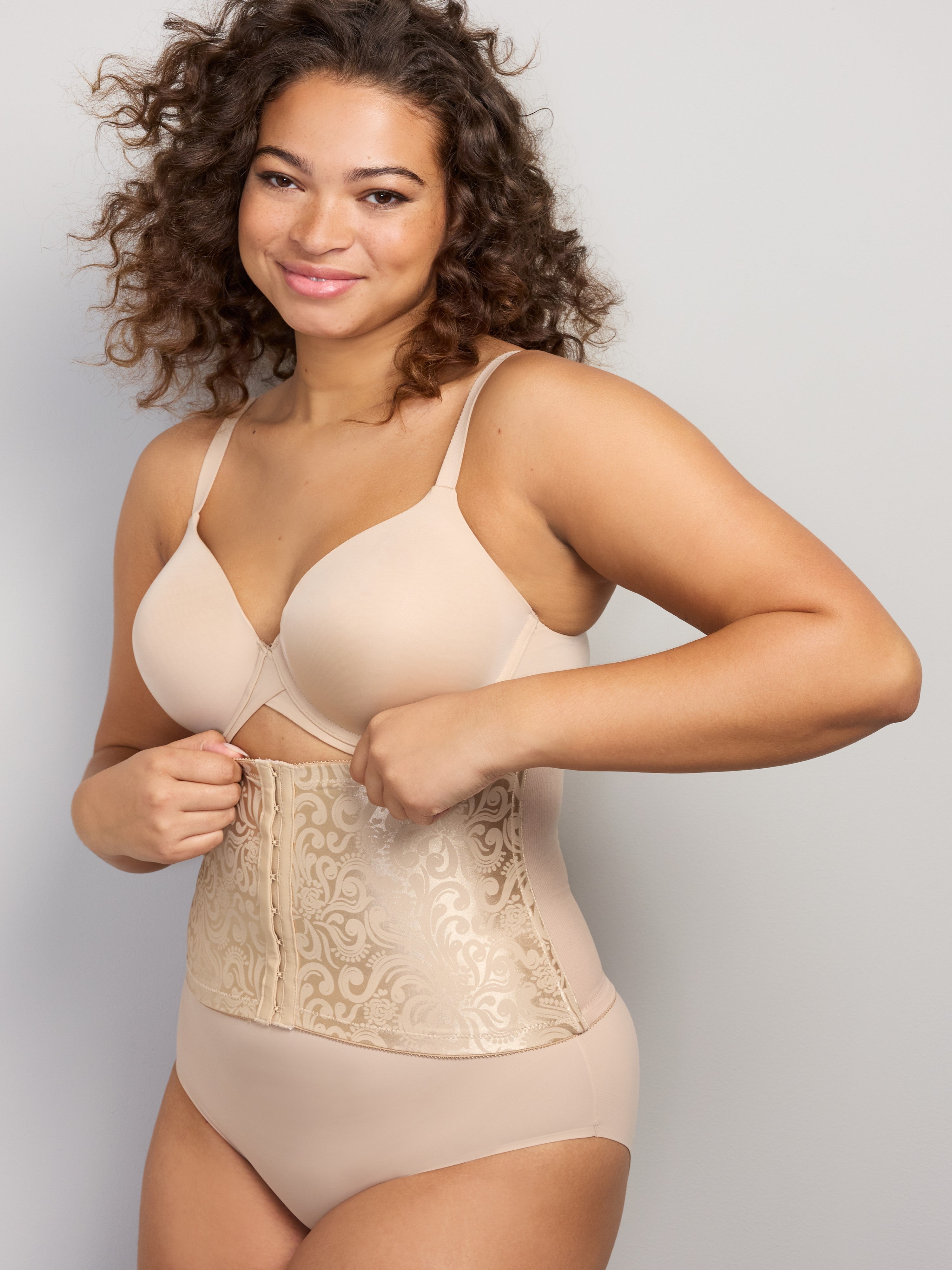 woman wearing a beige bra and shaping brief